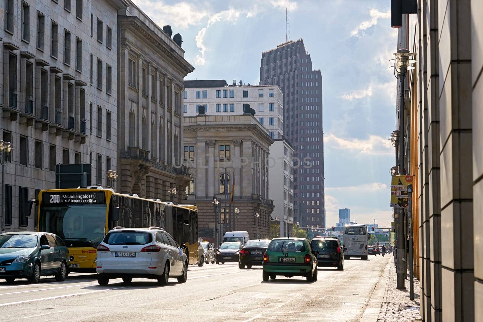 Road traffic on Leipziger Straße in Berlin during rush hour on a summer day