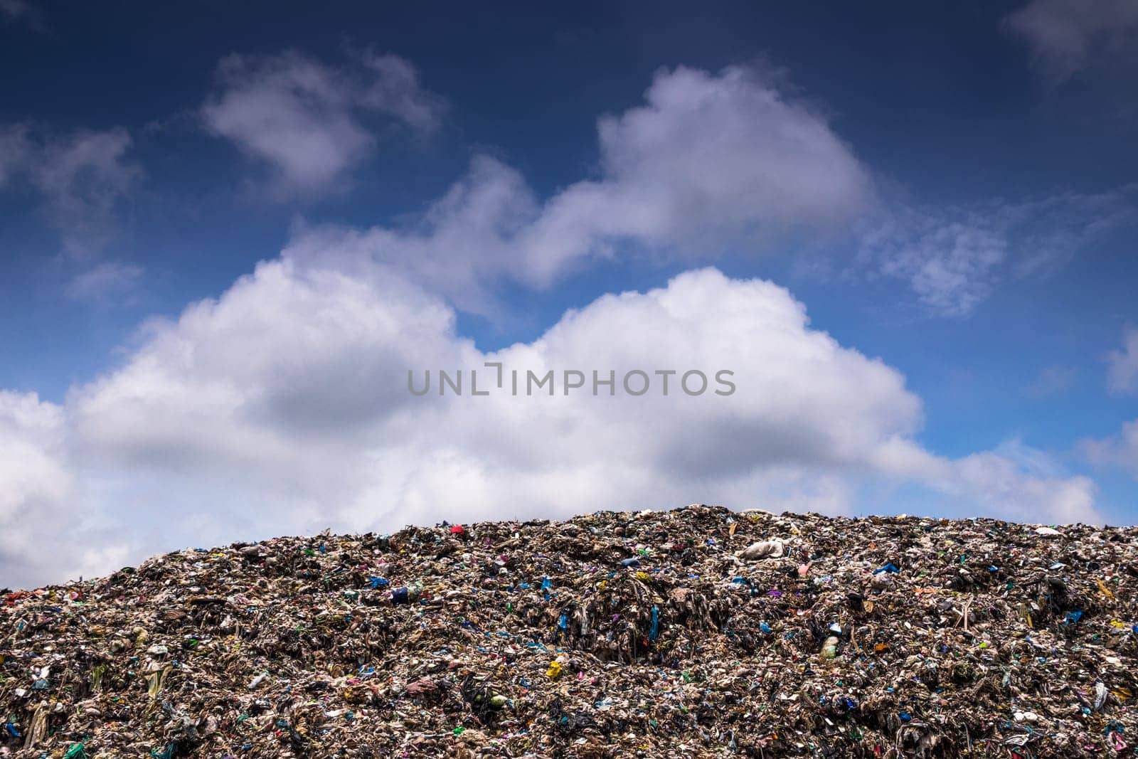 Landfill With Cumulus Clouds, landscape with garbage dump