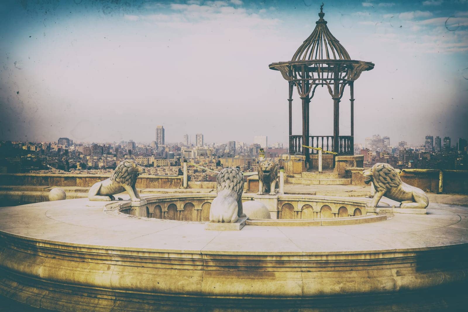 A fountain with lions and a rotunda in Cairo Citadel, retro style picture.