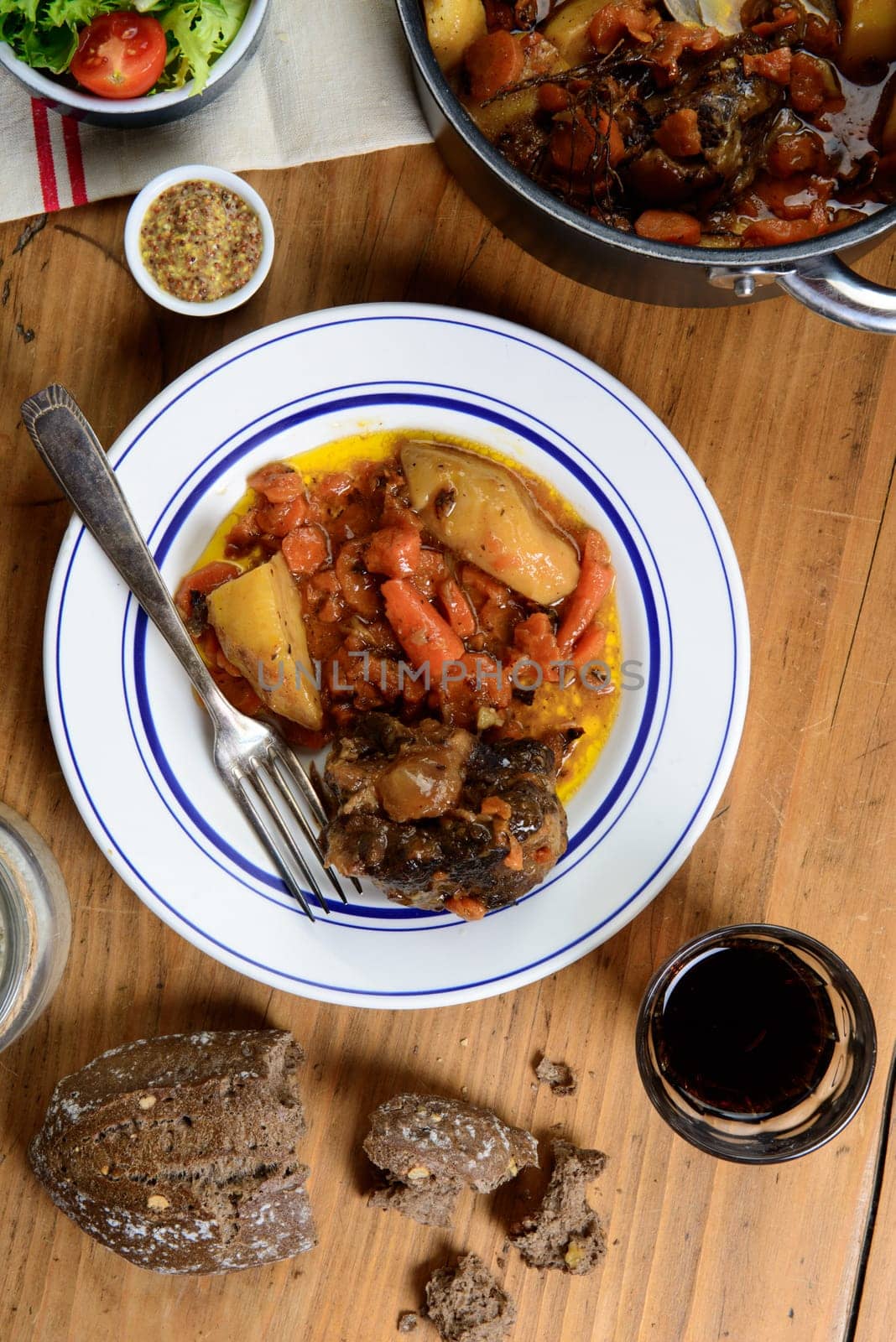 beef dish with carrots on the old table