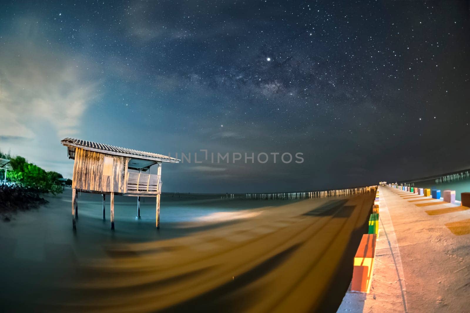 Old wooden house, no longer living in the sea, no way up the house Taken with the Milky Way as the back ground...