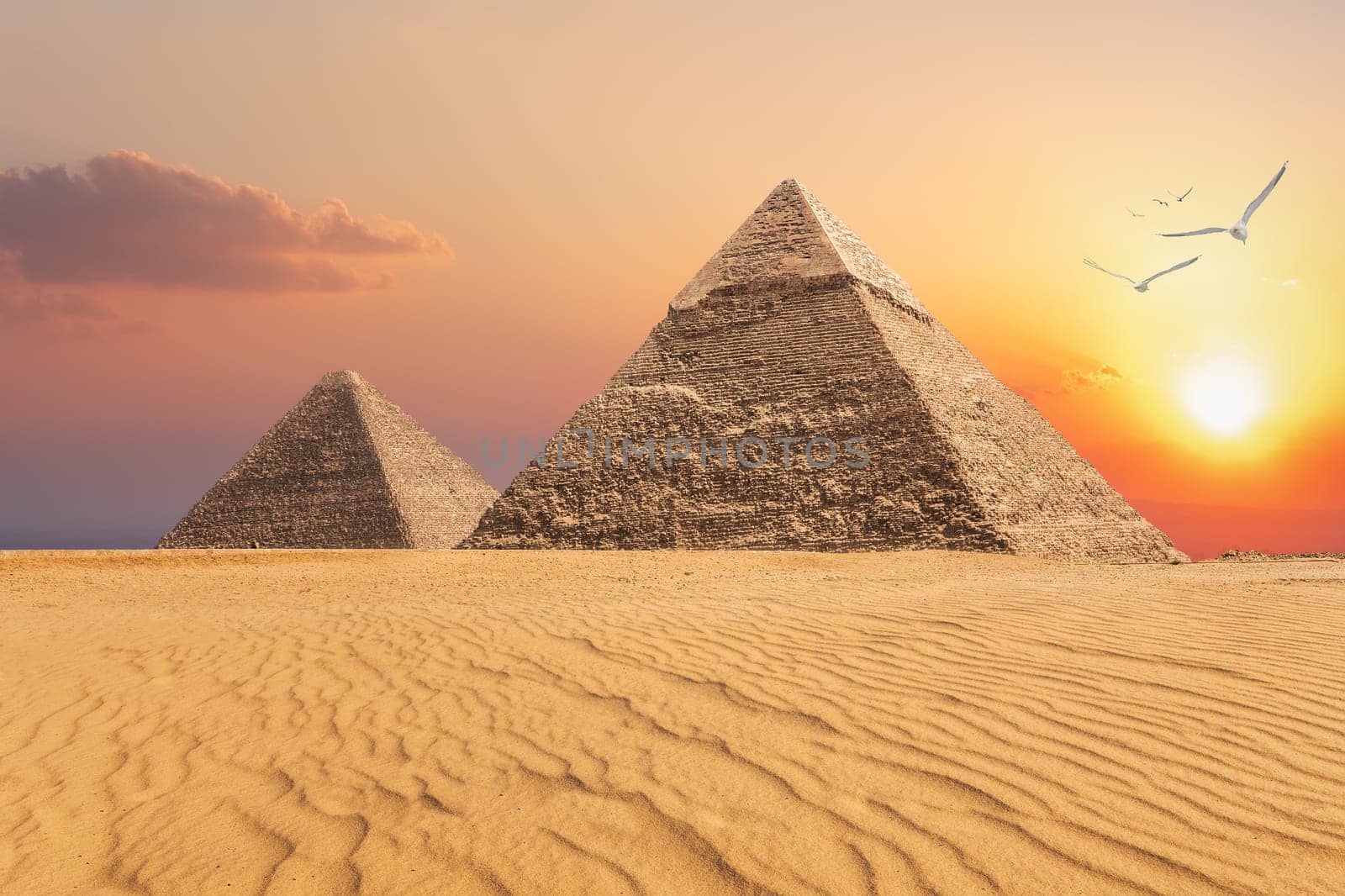 The Pyramid of Chephren and the Pyramid of Cheops, beautiful sunset view of Giza, Egypt.