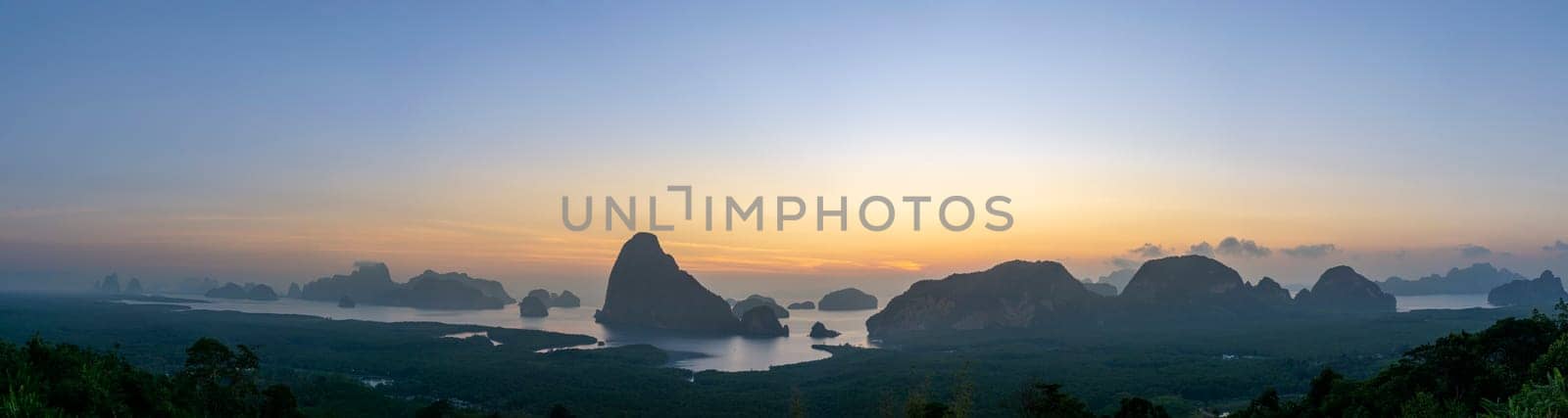Panorama Morning sunrise. Mountains in the Andaman Sea. March 2019: Samed Nang Phi Phang Nga, Thailand