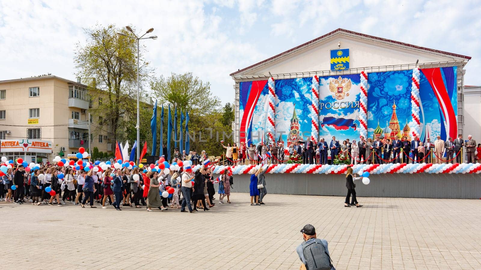 Anapa, Russia - May 1, 2019: Participants of the May Day demonstration in front of the stage in the Theater Square of the resort town of Anapa