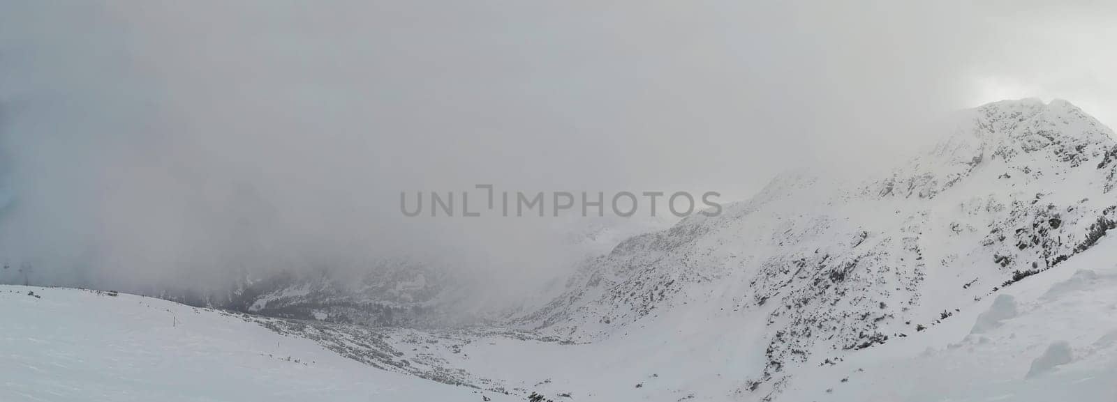 Beautiful foogy Winter morning in Mountains. Landscape with Todorka Peak panorama, Pirin mountain, Bansko, Bulgaria.
