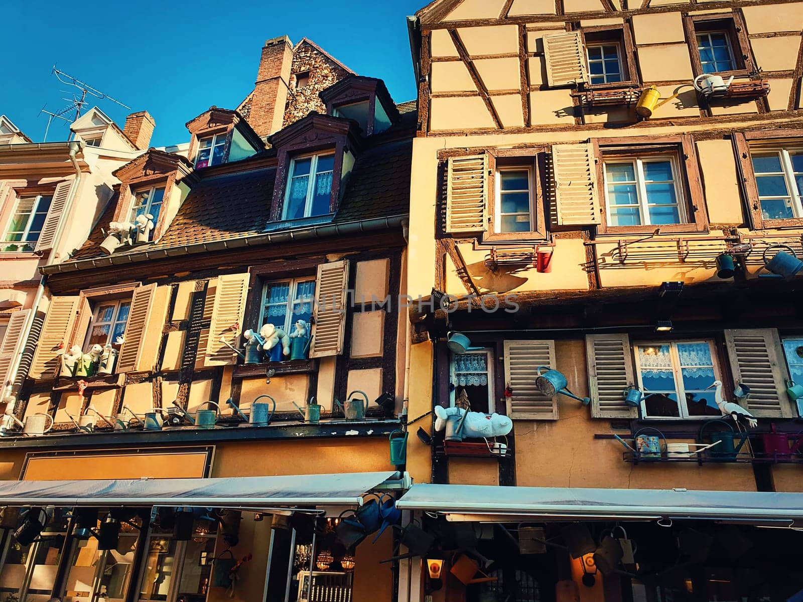 Colorful wooden building facade in Colmar city, France, Alsace. Historic town traditional house. Medieval architecture.