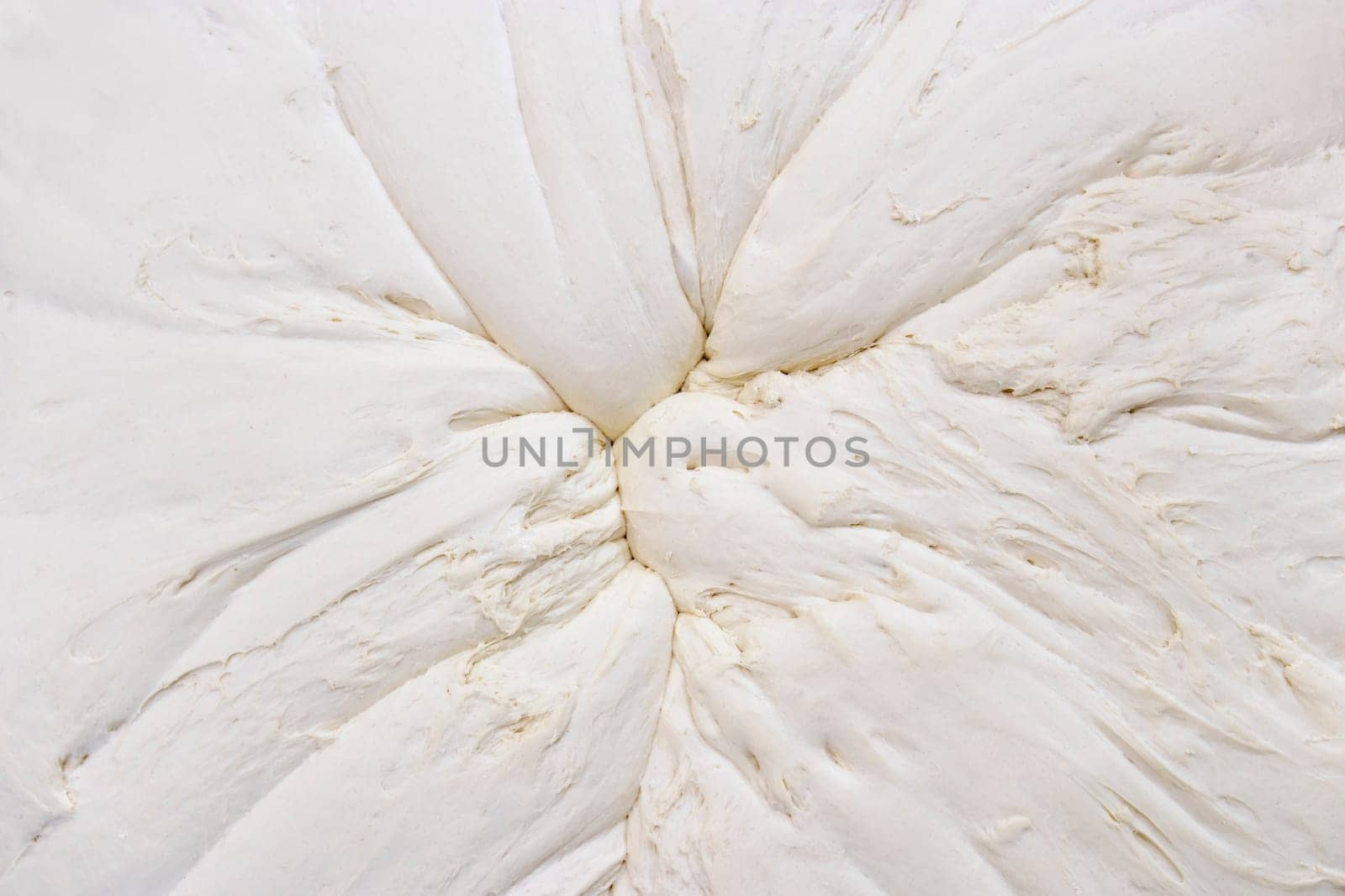 Mixed dough background from above that stands to yeast