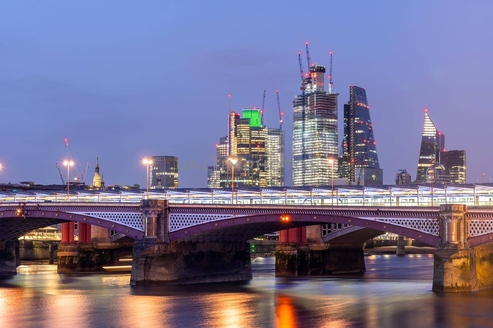 London Skylines building with river thames sunset twilight in London UK.
