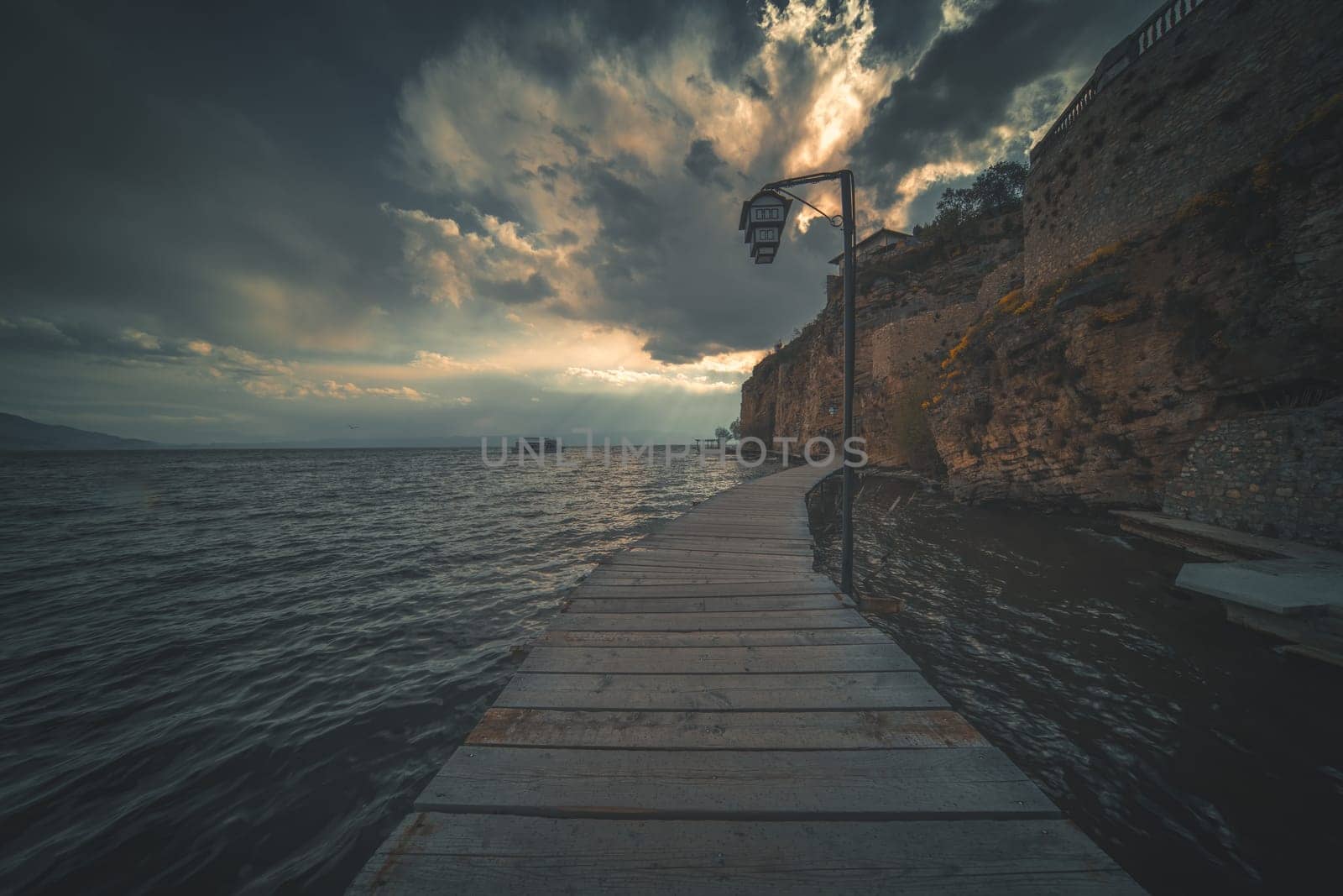 Wooden gangplank over Lake Ohrid at dusk, Republic of Macedonia