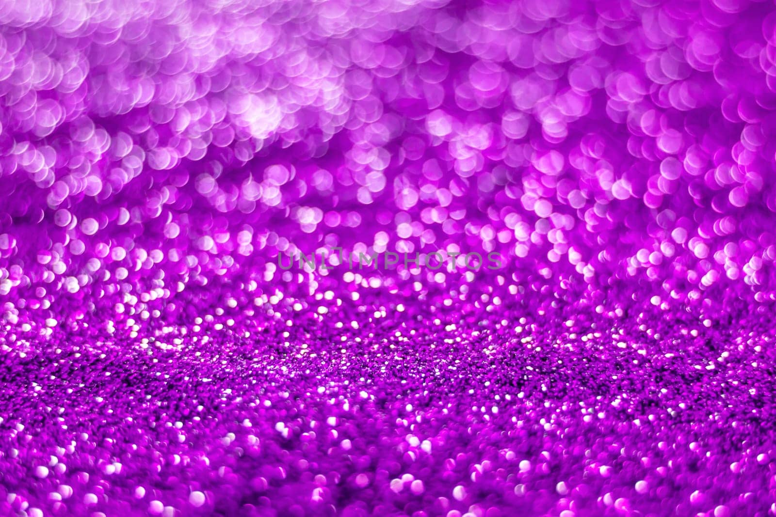 Glitter light abstract purple bokeh christmas light blurred background