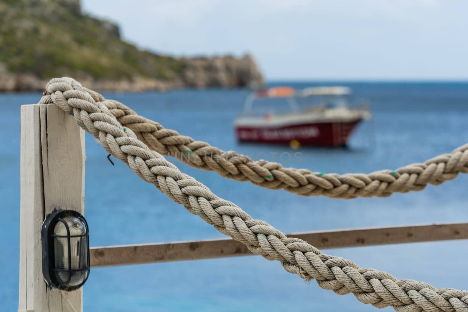 Ropes around wooden restaurant platform in Agios Nikolaos beach on Zakynthos Island, Greece