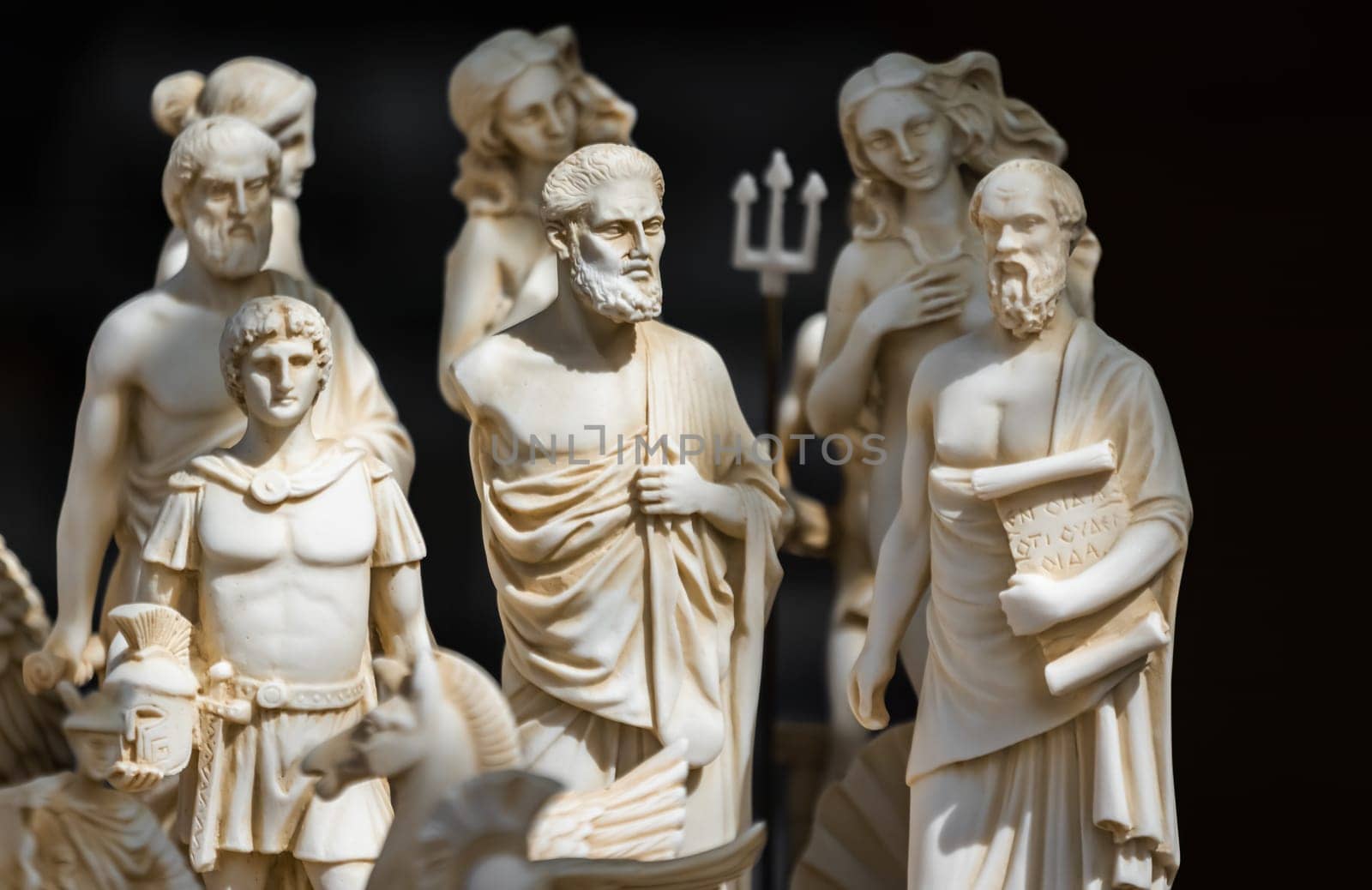 Small statuettes resembling people from ancient Rome and Greece on sale on a souvenir stand, Greece