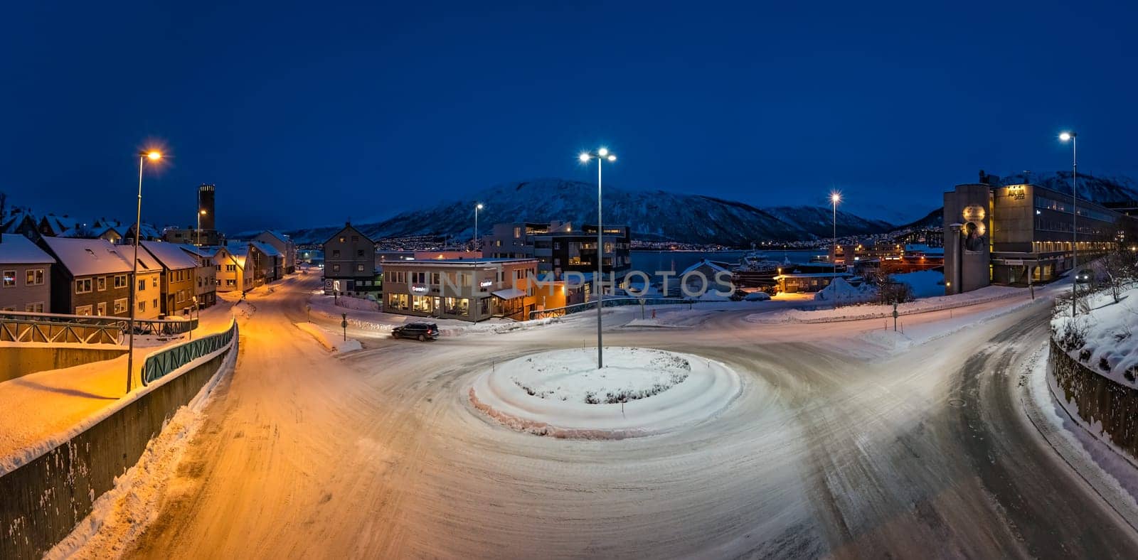 Tromso, Norway -  December 2018 : Panoramic view of the snow covered roundabout in the city of Tromso in winter