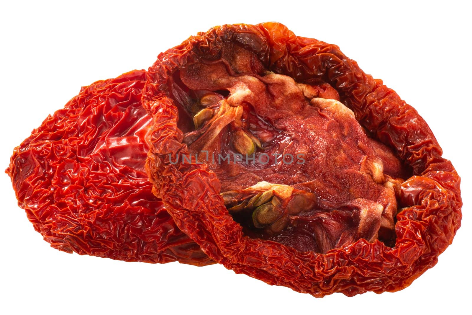 Sundried or dried globe tomato halved, isolated