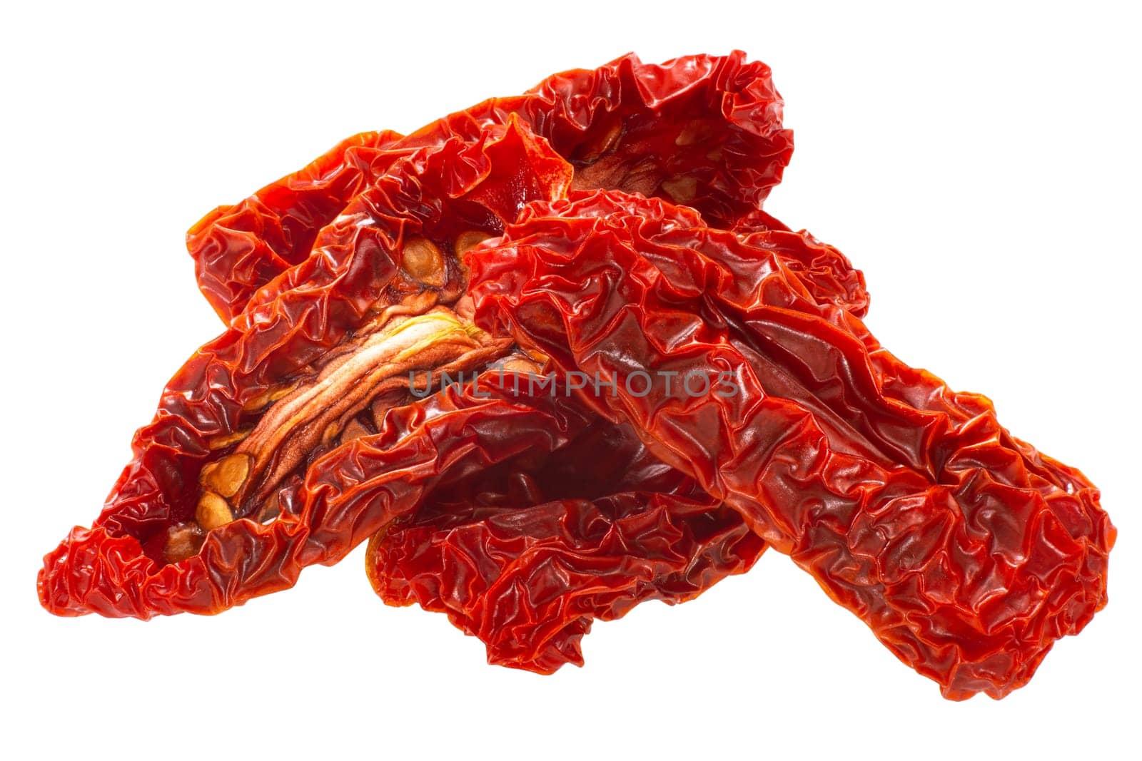 Sundried or dried datterini tomato halves, isolated, pile of