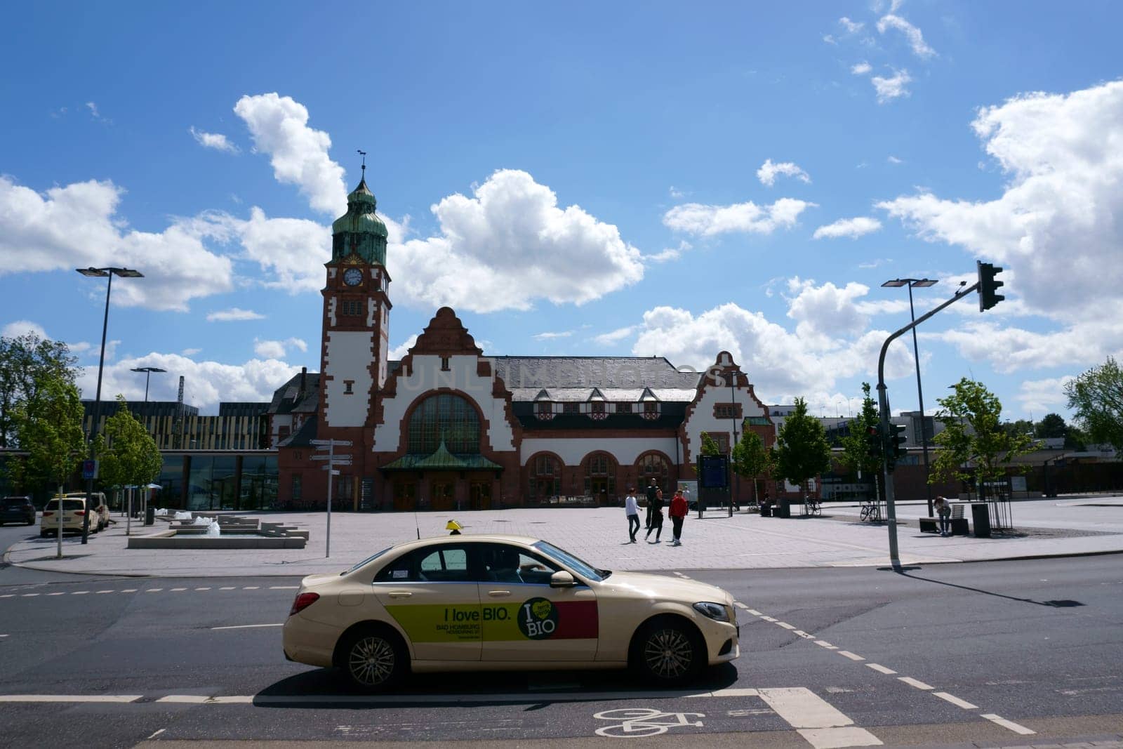 Bad Homburg, Germany - June 09, 2019: Tourists and travelers on the forecourt of the historic main train station on June 09, 2019 in Bad Homburg...
