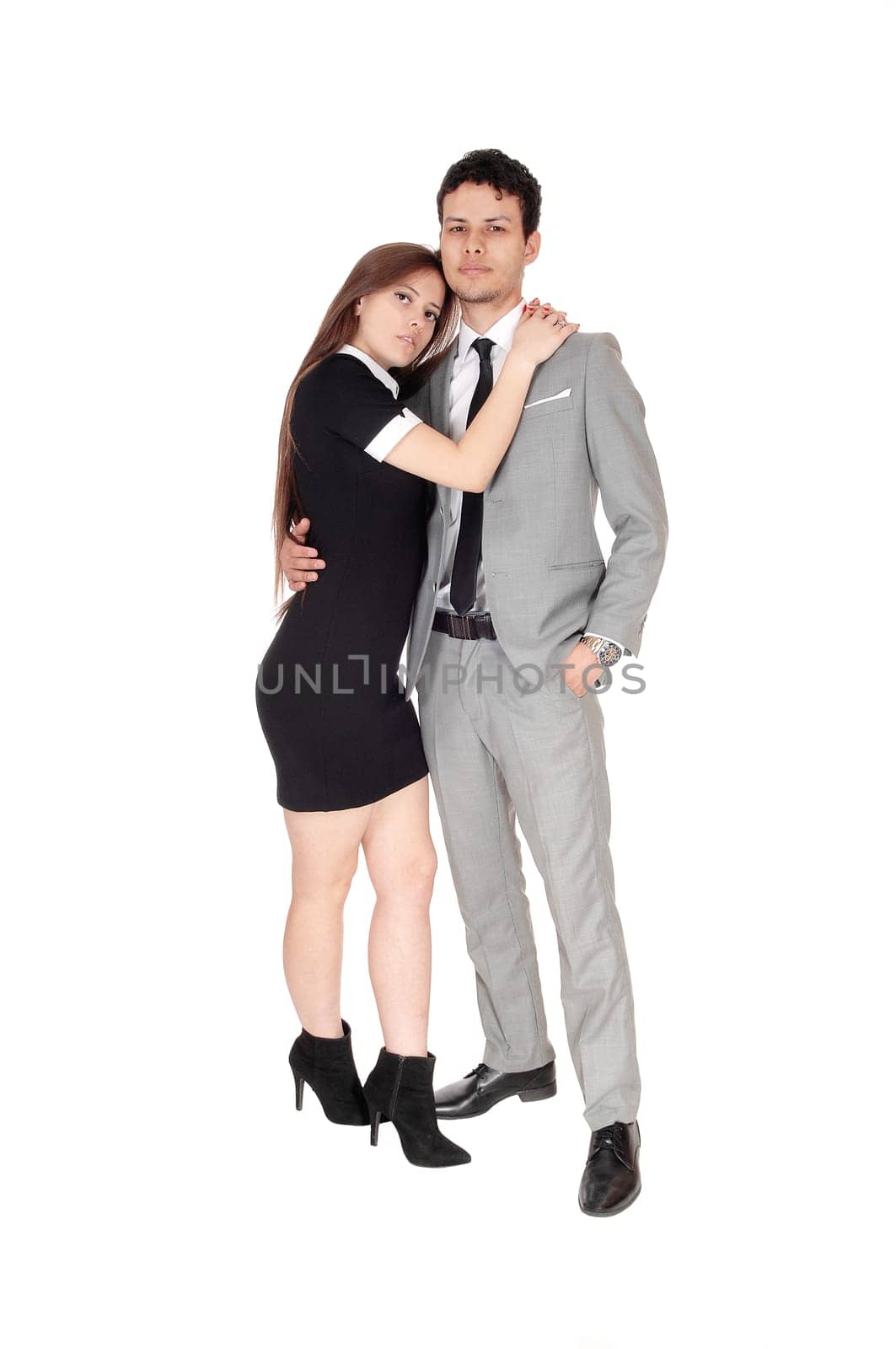 A lovely young couple standing in a black dress and light gray suit, loving.each other, isolated for white background.
