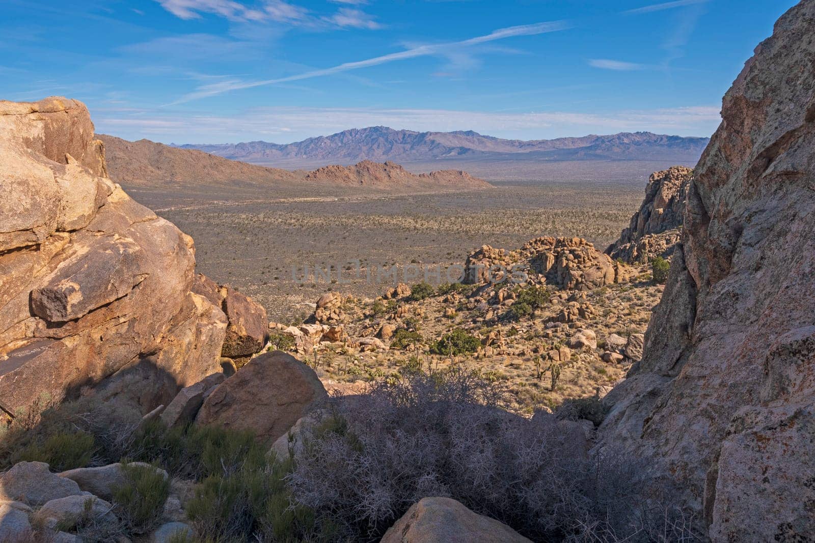 Desert Vista Through a Rocky Window on Teutonia Peak in the Mojave National Preserve in California