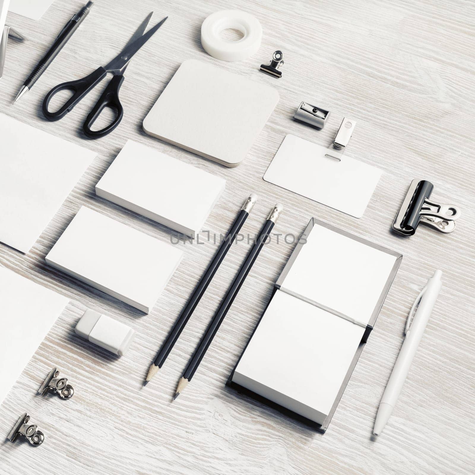 Blank stationery mock up on light wooden background.