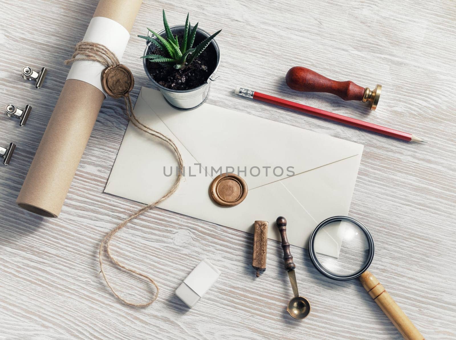 Vintage stationery set on light wood table background.