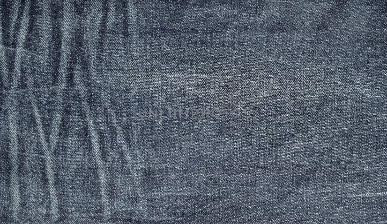 Old jeans texture. Vintage denim as background.