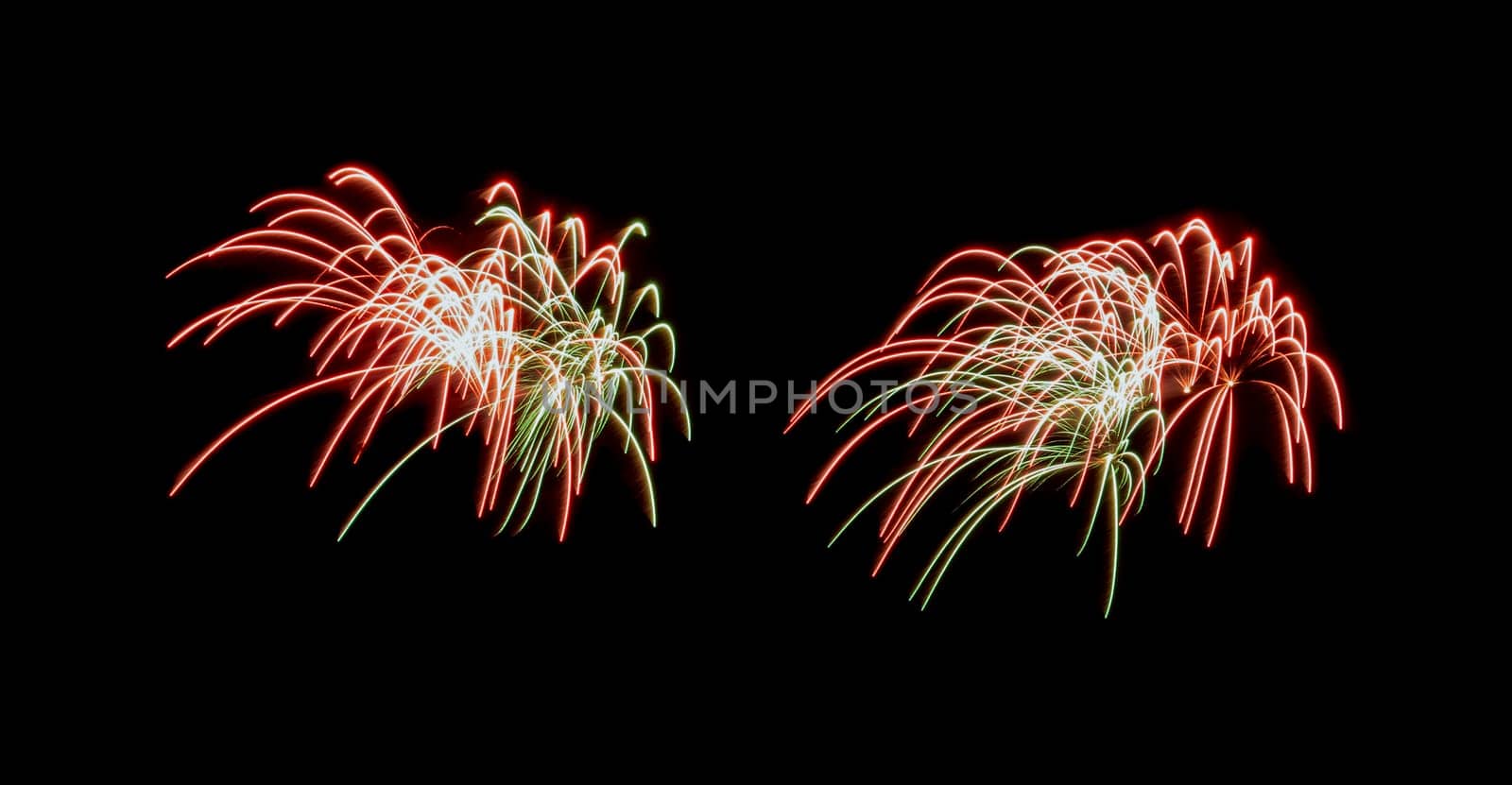 Red and green exploded fireworks display, isolated on black background