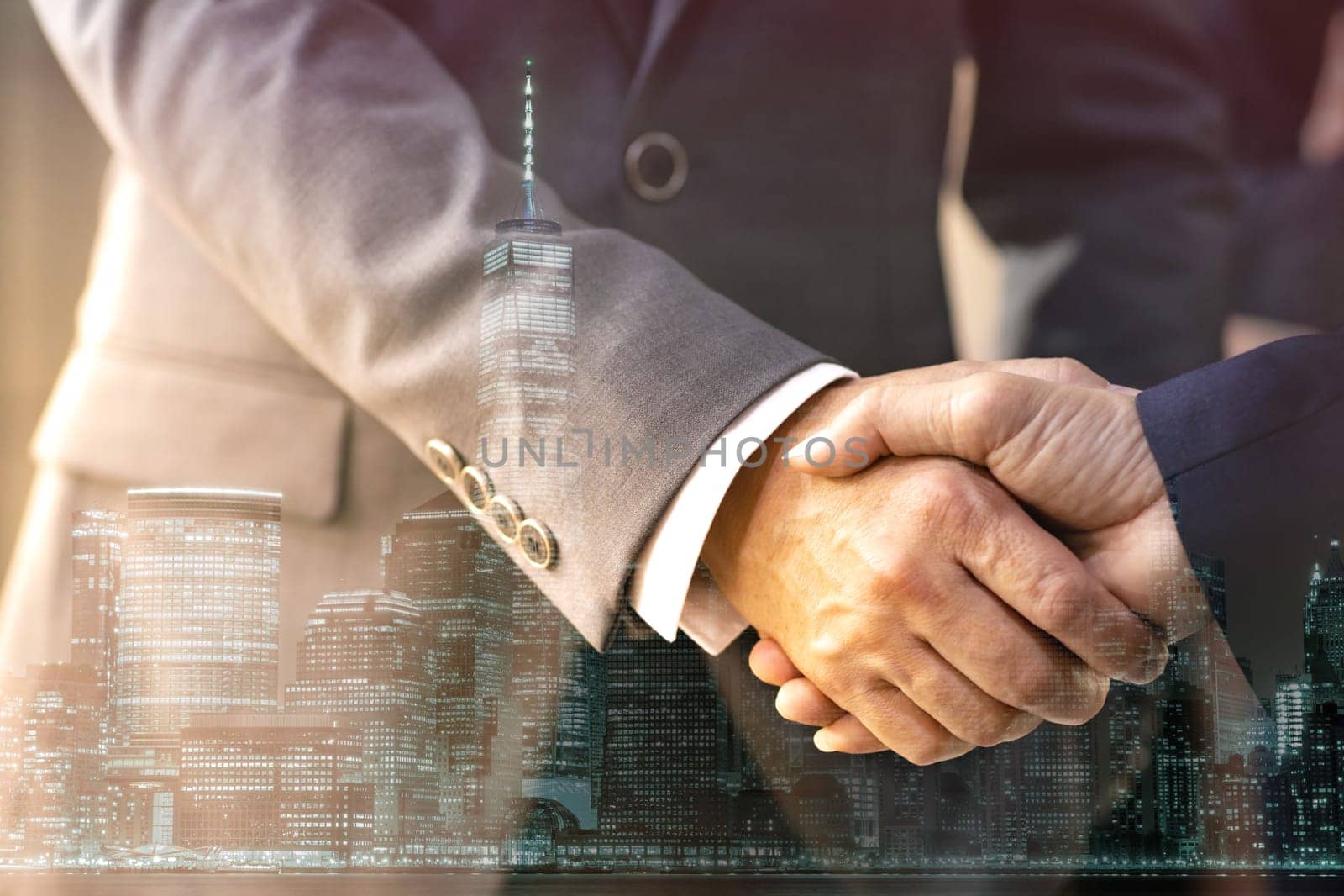 Double exposure of business Handshake with new york manhattan skyline building background