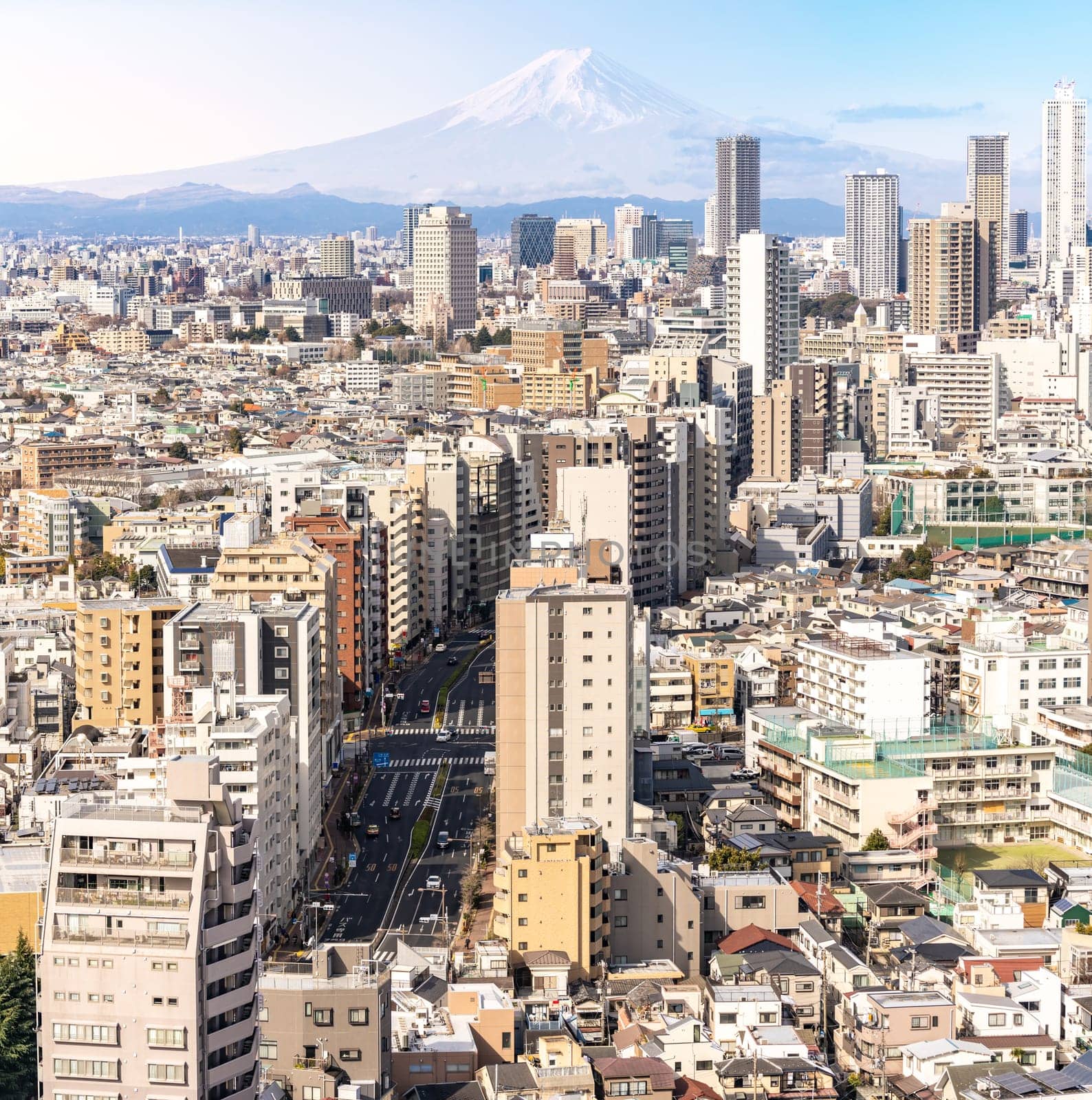 aerial view of Tokyo skylines and skyscrapers buildings in Shinjuku ward in Tokyo with Mountain Fuji in background