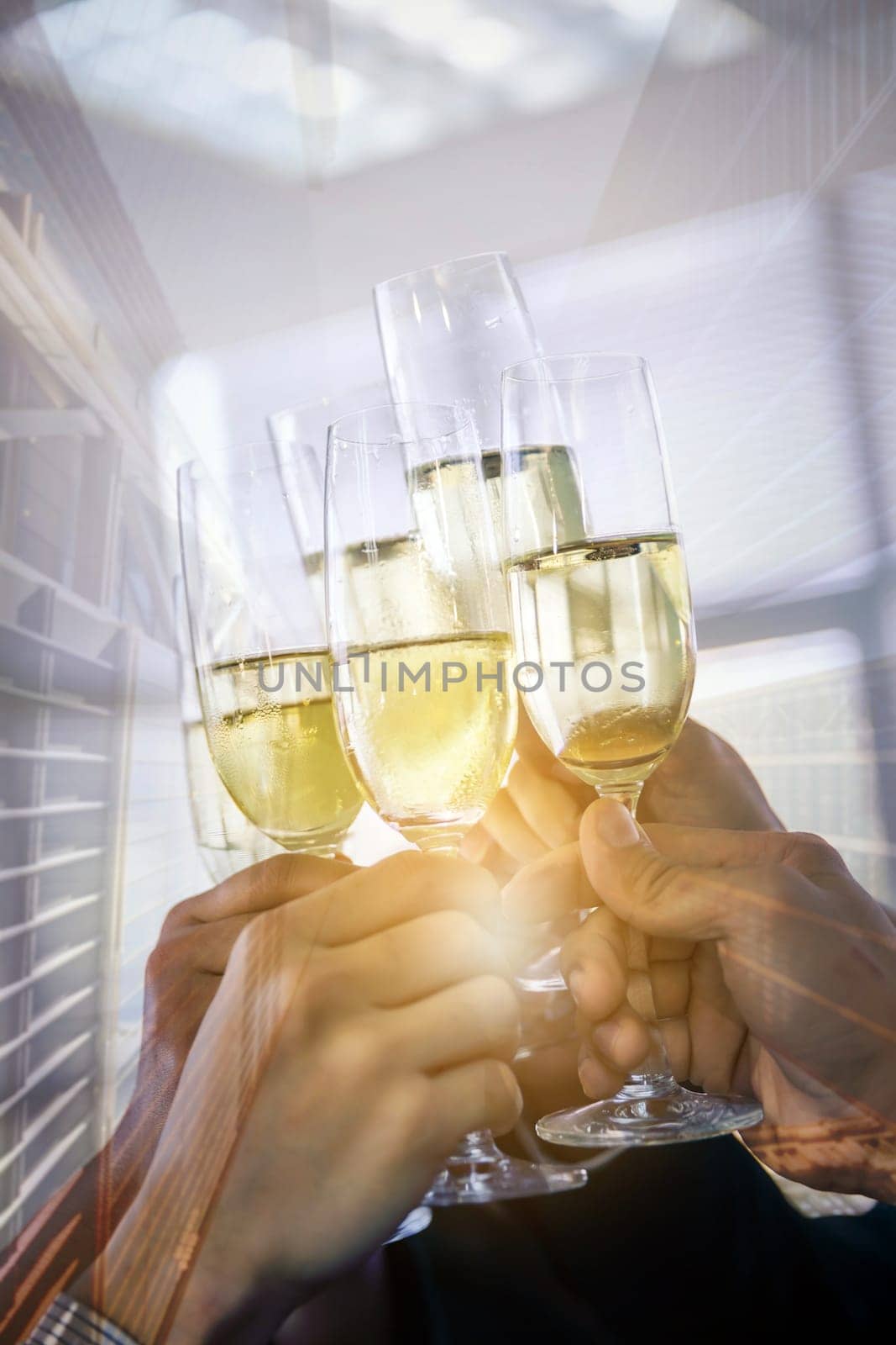 Double exposure of hand with champagne business celebration with skyline building background