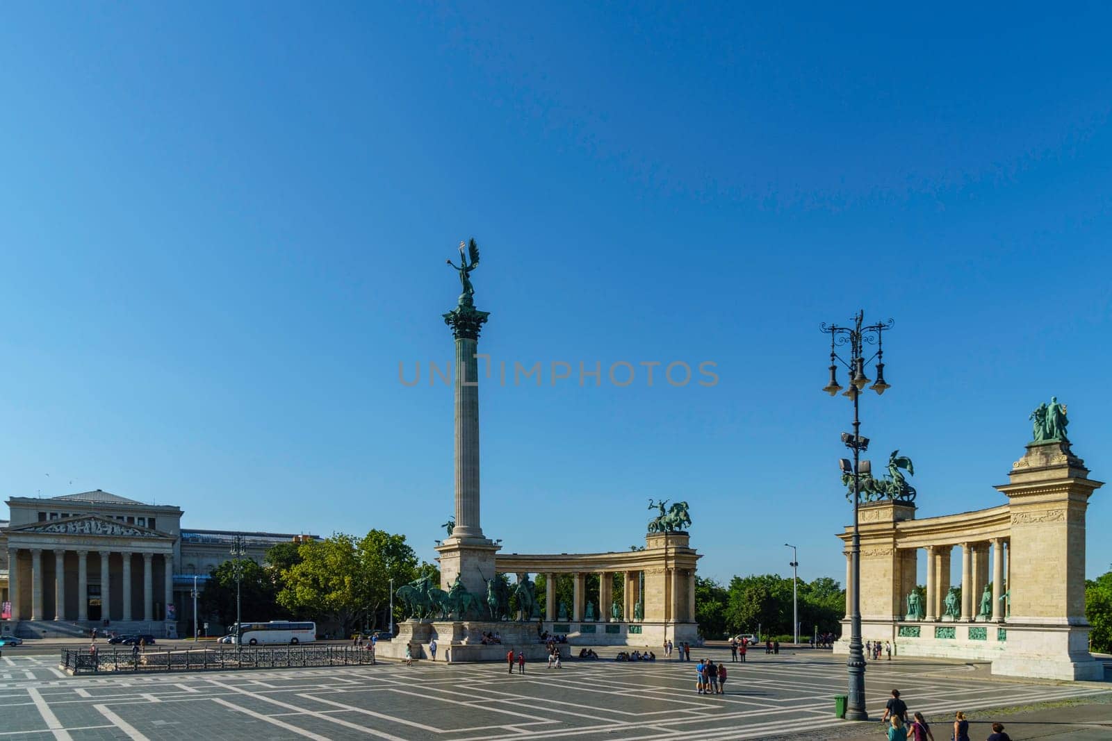 Budapest, Hungary - July 04, 2019: Heroes Square with Millenium Memorial and the horseman Memorial is one of the major squares in Budapest. Panorama with tourists and visitors.