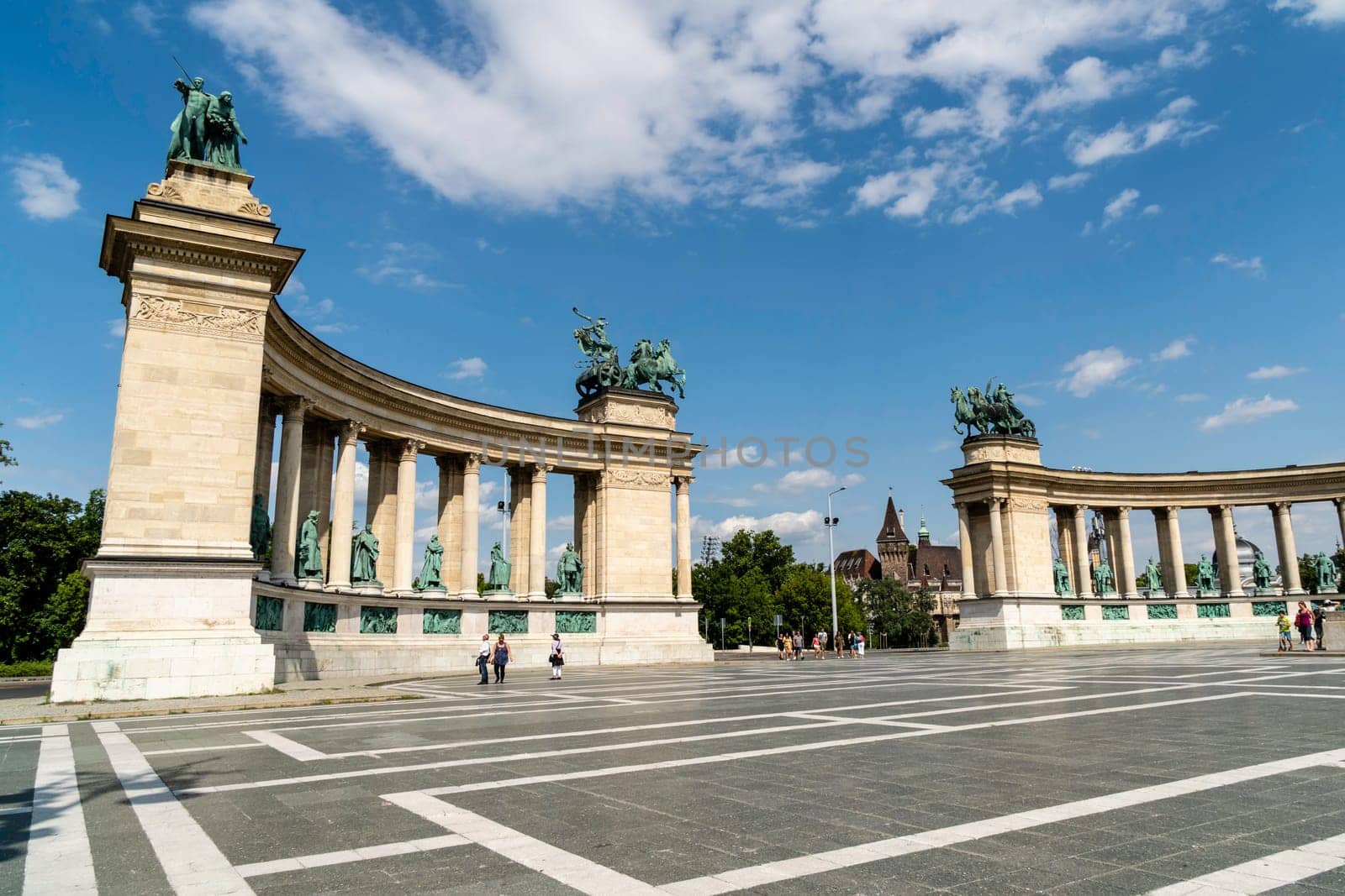 Budapest, Hungary - July 04, 2019: Heroes Square with Millenium Memorial and the horseman Memorial is one of the major squares in Budapest. Panorama with tourists and visitors.