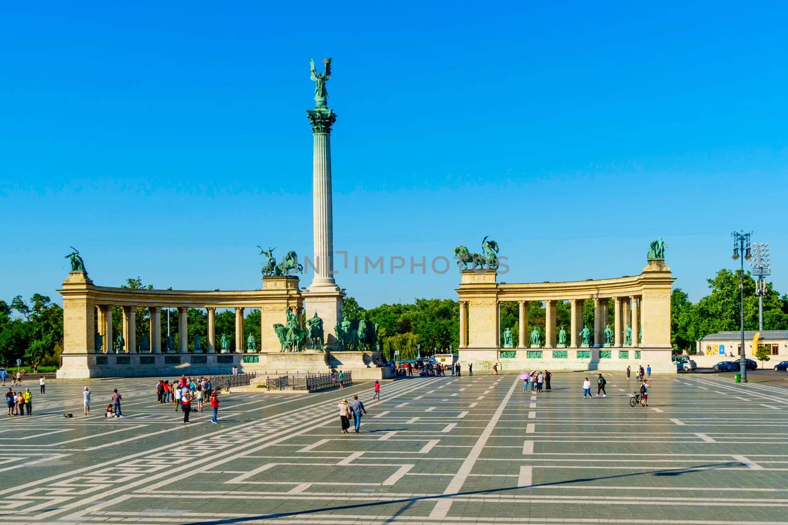 Budapest, Hungary - July 04, 2019: Heroes Square with Millenium Memorial and the horseman Memorial is one of the major squares in Budapest. Panorama with tourists and visitors.