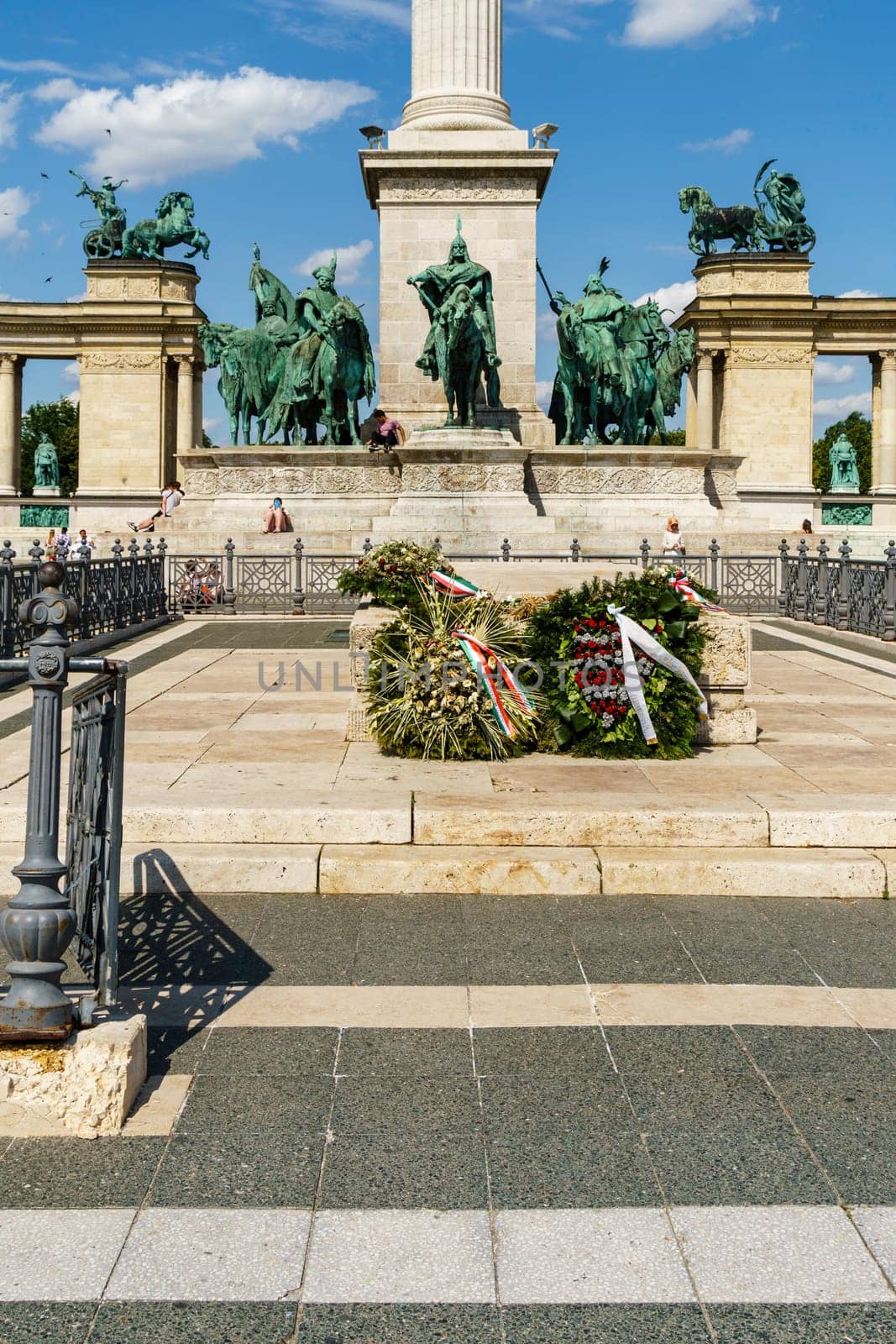 Budapest, Hungary - July 04, 2019: Heroes Square with Millenium Memorial and the horseman Memorial is one of the major squares in Budapest. Panorama with tourists and visitors.
