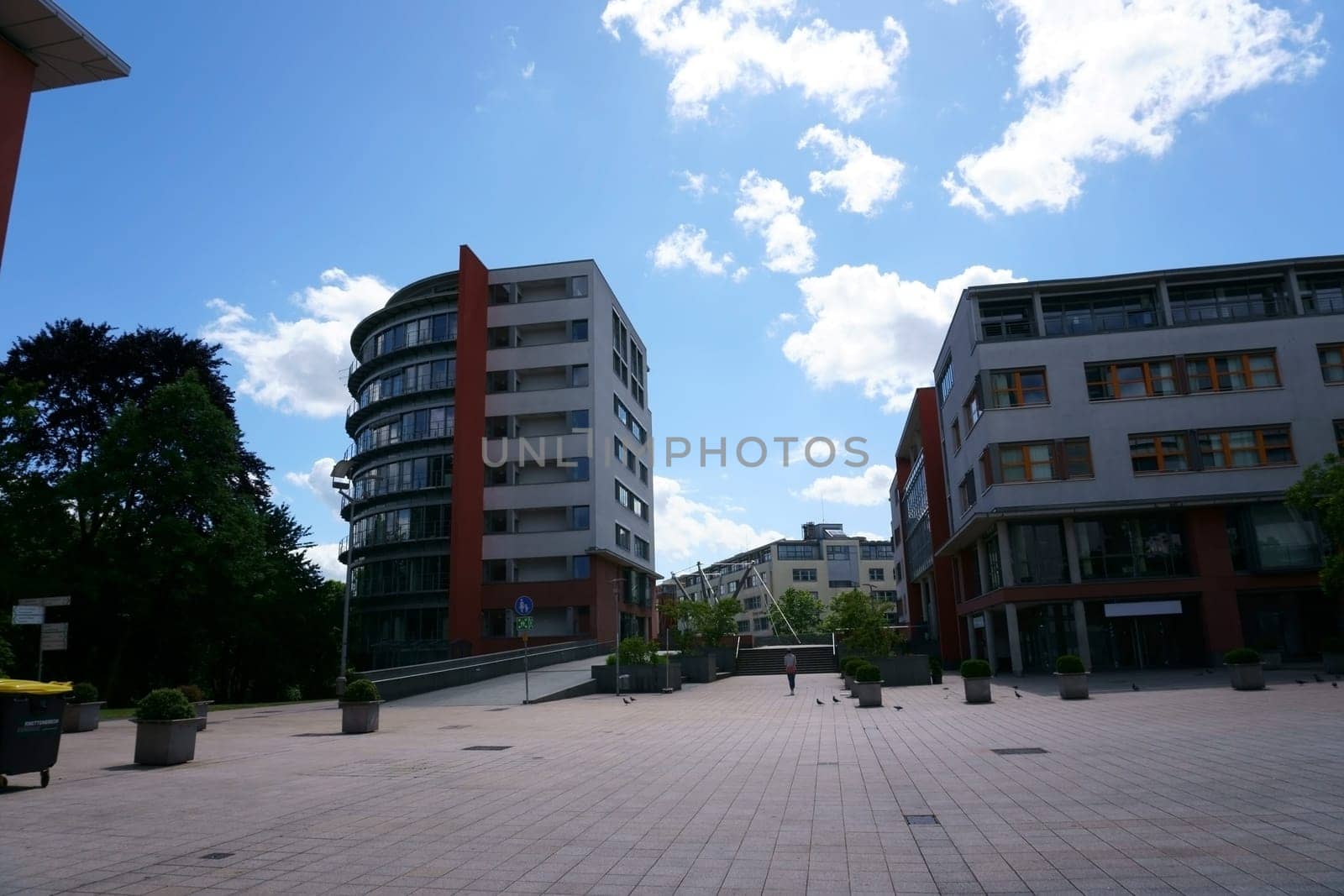 The town hall square in Bad Homburg with modern residential and commercial buildings as well as the pedestrian bridge over the Hessenring...