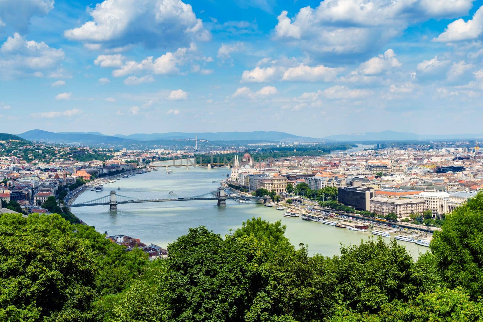 Panorama of Budapest over the Danube river. The bridges destroyed in World War II touch the two parts of the city Buda and Pest. The bridges stand out for their majesty and elegance.