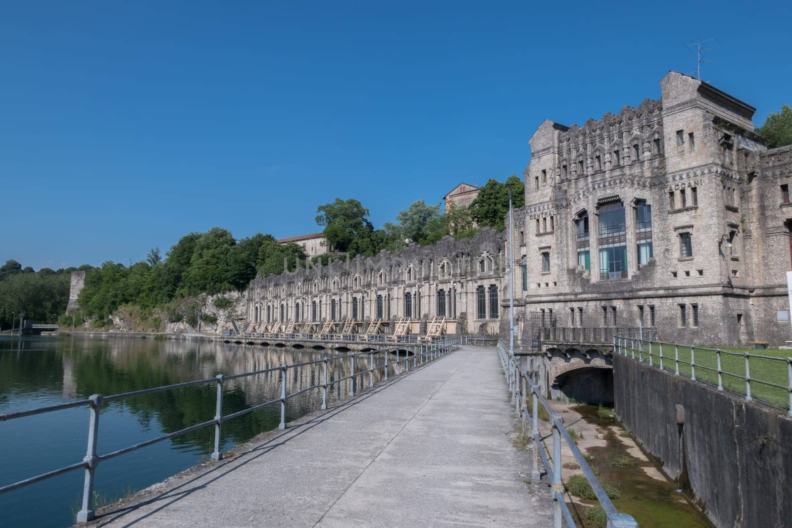 Taccani hydroelectric power plant and Visconteo Castle. Trezzo sull'Adda (MILAN), ITALY - May 31, 2019.