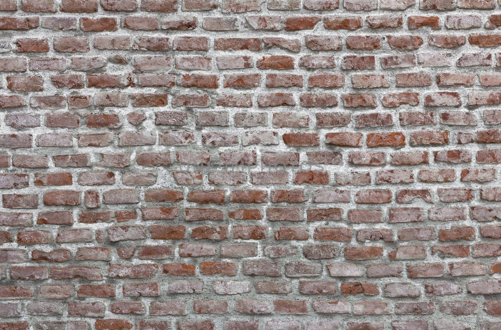 Old Red Bricks wall, they have faded over time. Ideal for texture and backgrounds.