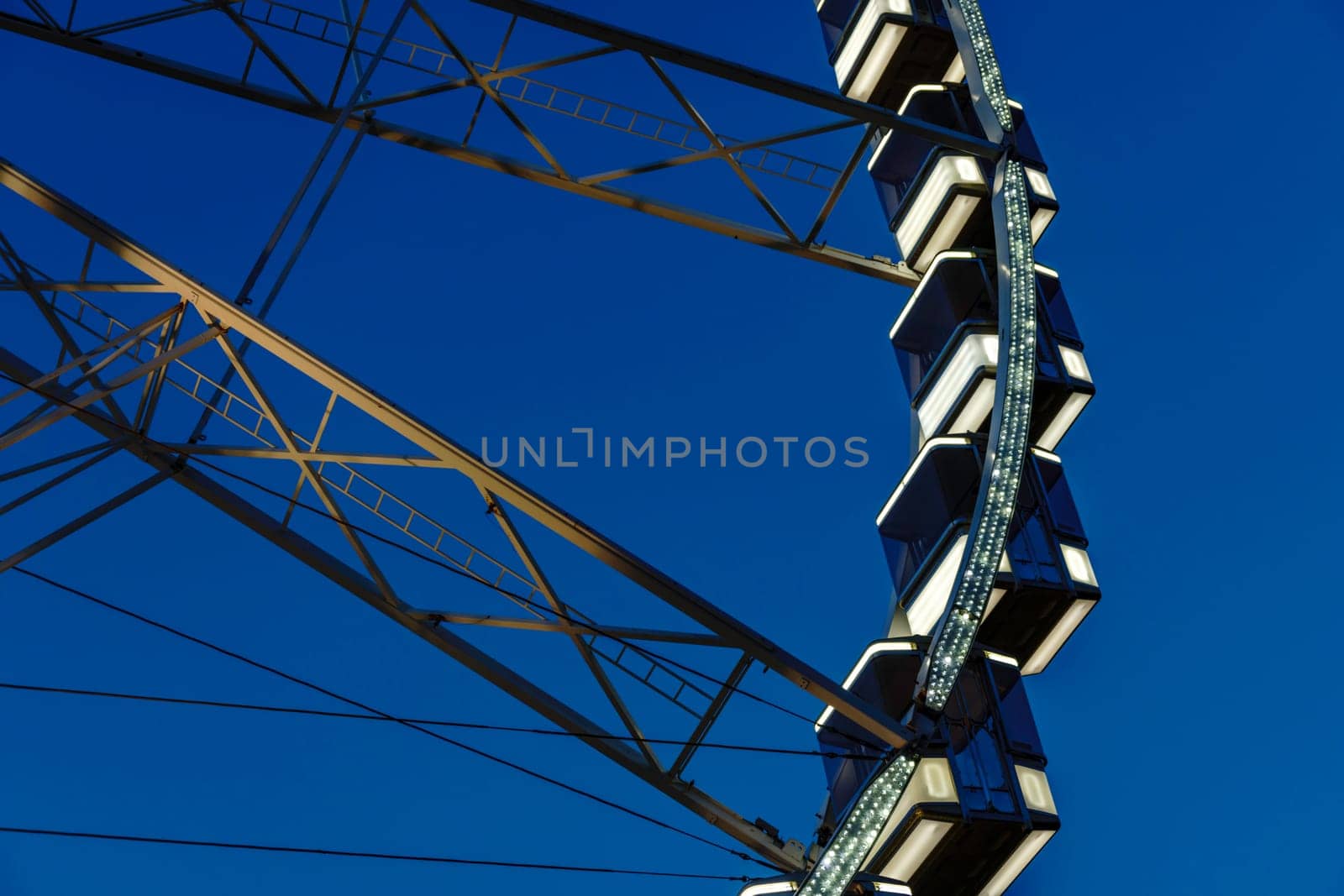 Budapest, Hungary - July 05, 2019: Luminous Ferris wheel in night city. Budapest Eye at night. Sziget Eye. The new Ferris Wheel opened on Erzsébet Square in mid-march 2017 and it will operate throughout the year.
