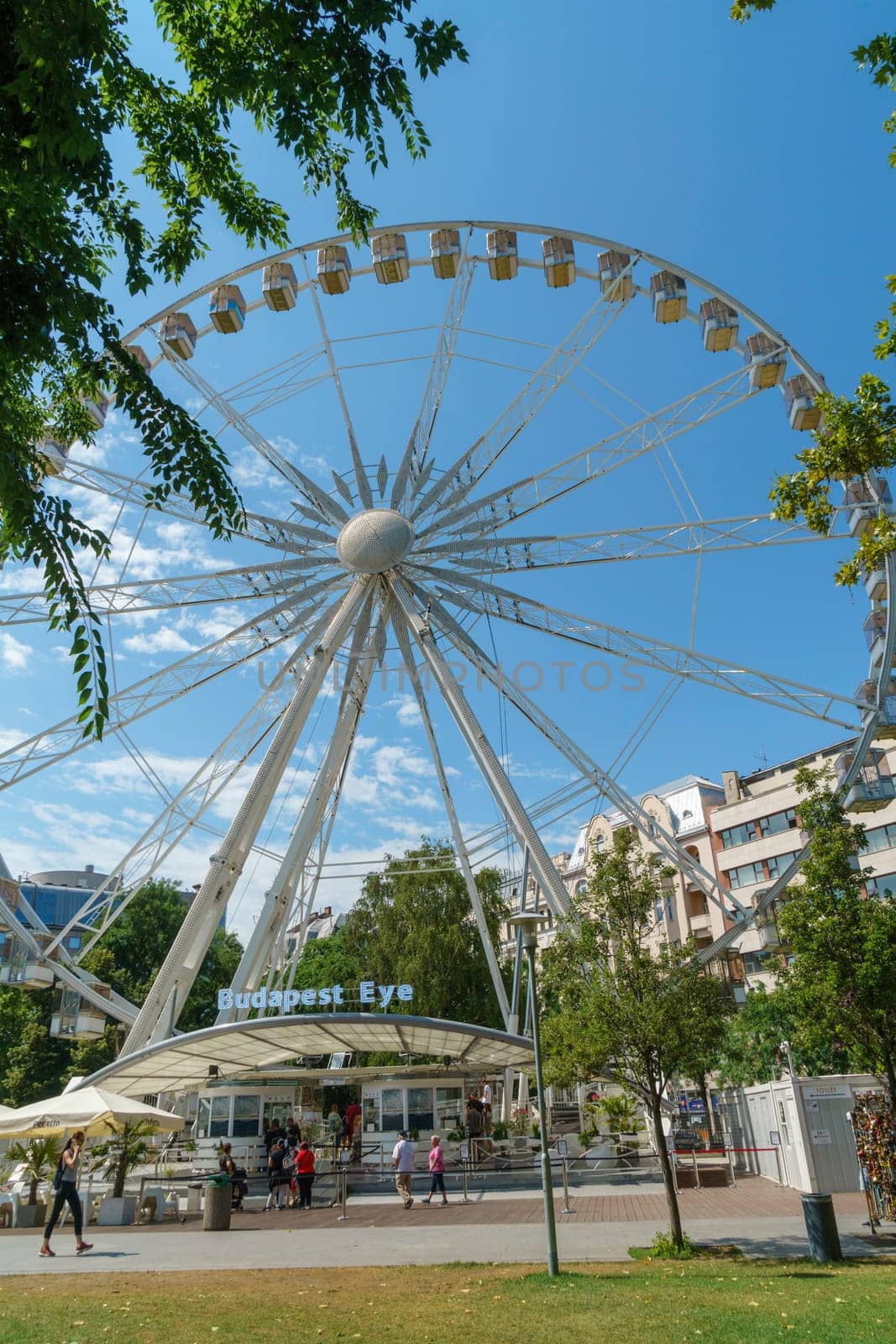 Budapest, Hungary - July 05, 2019: Luminous Ferris wheel in night city. Budapest Eye at night. Sziget Eye. The new Ferris Wheel opened on Erzsébet Square in mid-march 2017 and it will operate throughout the year.