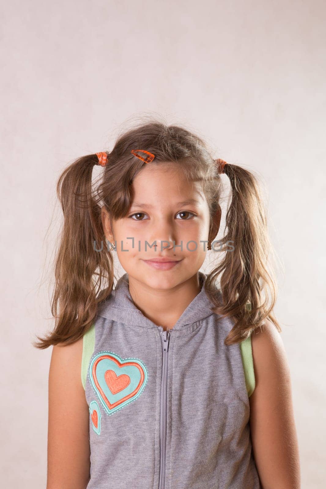 Cute little girl smiling looking
