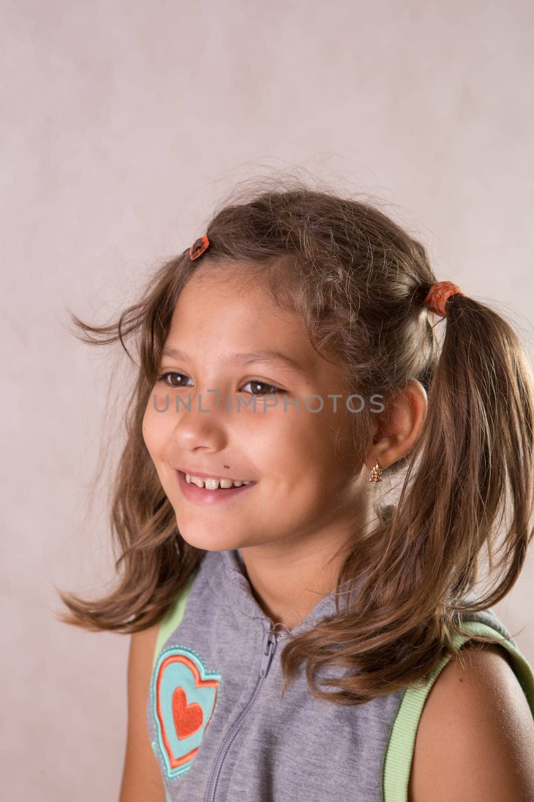 Cute little girl smiling looking