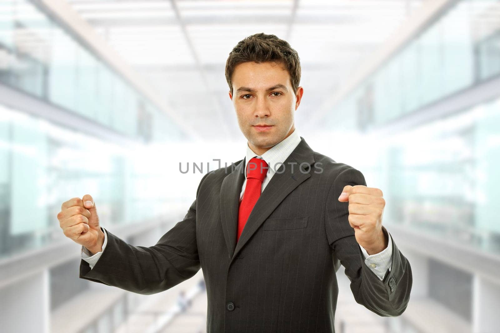 successful business man with open arms winning at the office