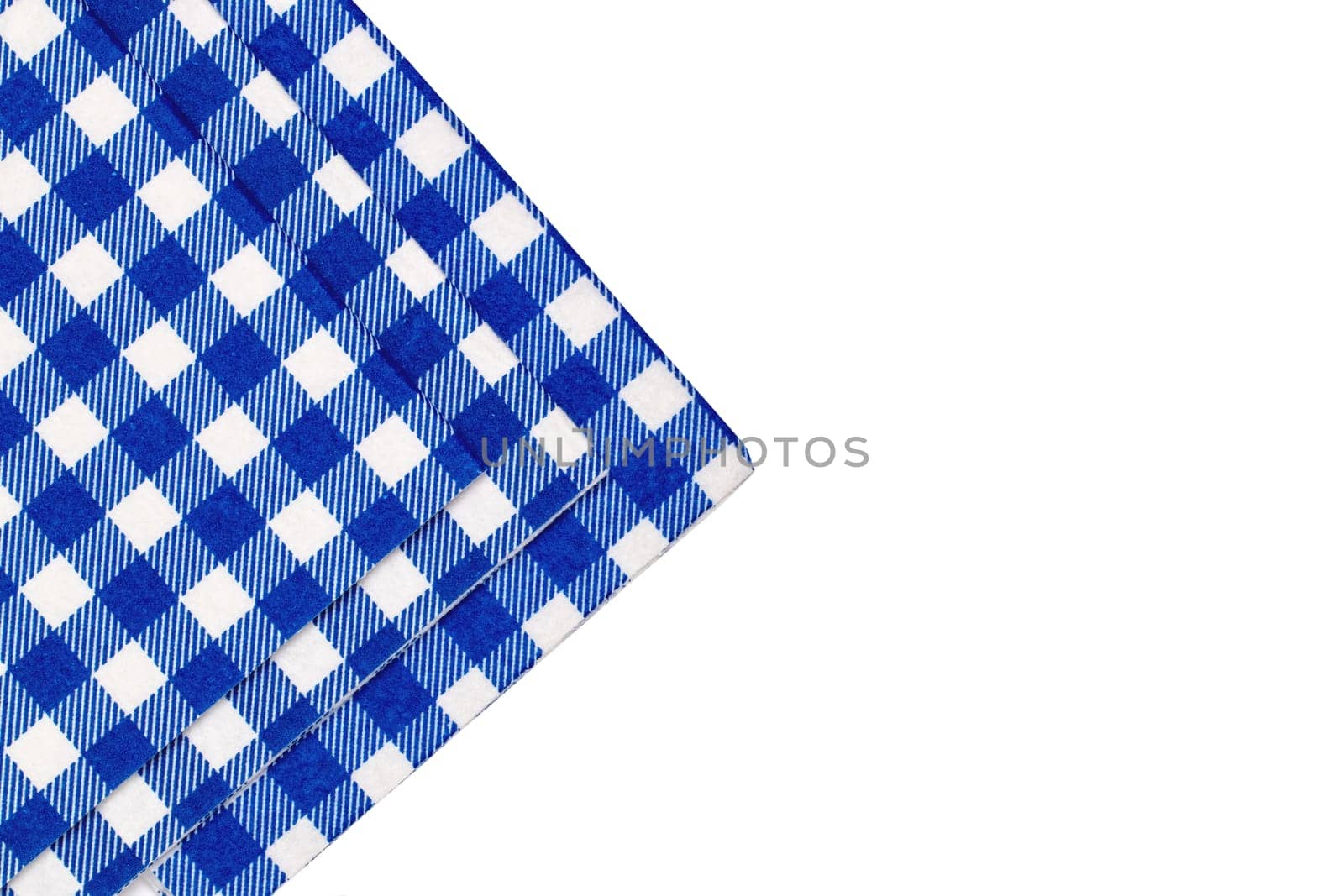 Closeup of a set of blue and white checkered kitchen cloth or napkin isolated on white background. Kitchen accessories. Macro.