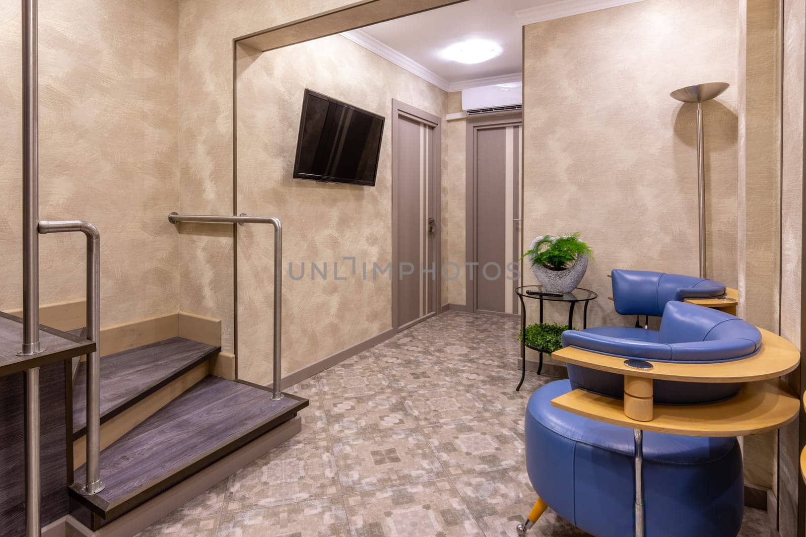 Spacious entrance hall to several rooms and a staircase to the second floor