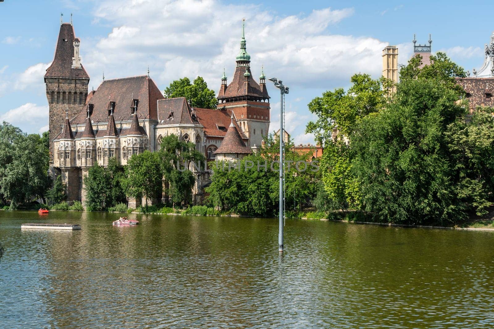 Budapest, Hungary - July 04, 2019: The Vajdahunyad castle, built to celebrate the Millennium, perfectly illustrates the different architectural styles that characterize Hungary. It is partly inspired by the castle of Honedoara (Transylvania, Romania).