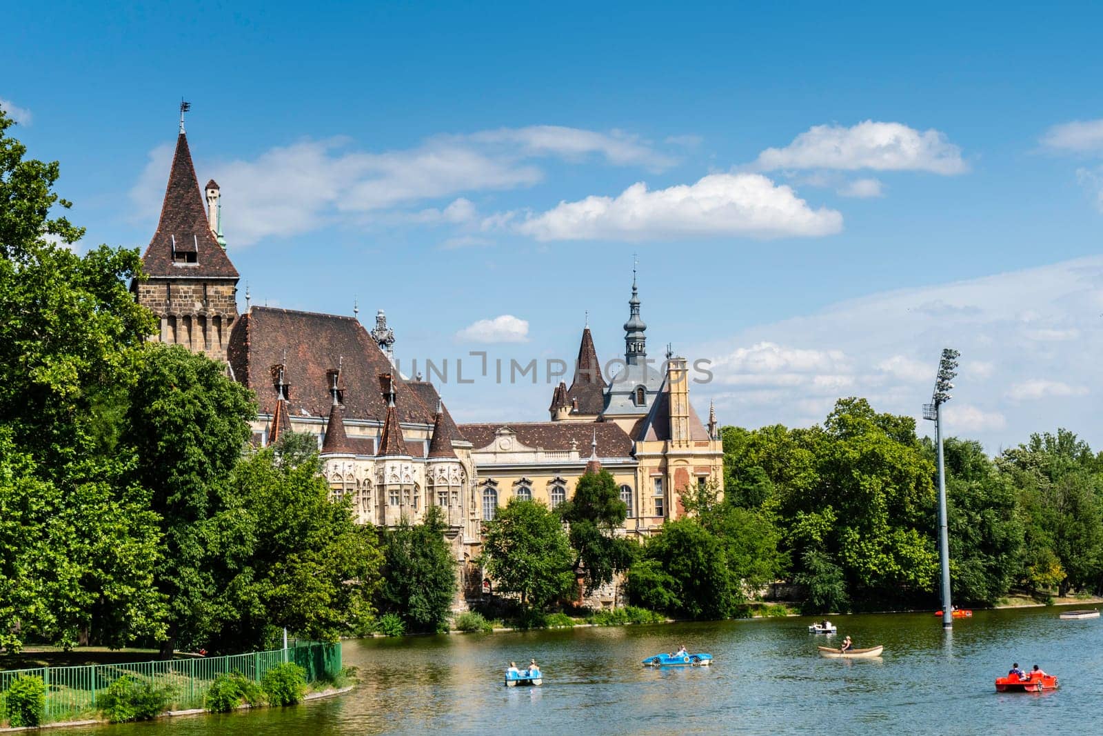 Budapest, Hungary - July 04, 2019: The Vajdahunyad castle, built to celebrate the Millennium, perfectly illustrates the different architectural styles that characterize Hungary. It is partly inspired by the castle of Honedoara (Transylvania, Romania).