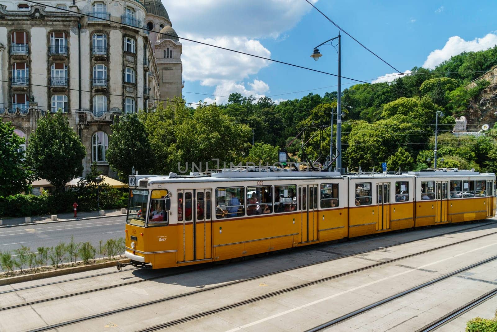 Budapest, Hungary _ July 05, 2019: The Budapest tram network is part of the mass transit system of Budapest, the capital of Hungary. The tram lines carrying nearly 100 million passengers and tourists. Characteristic and very beautiful to see. Budapest, Hungary.