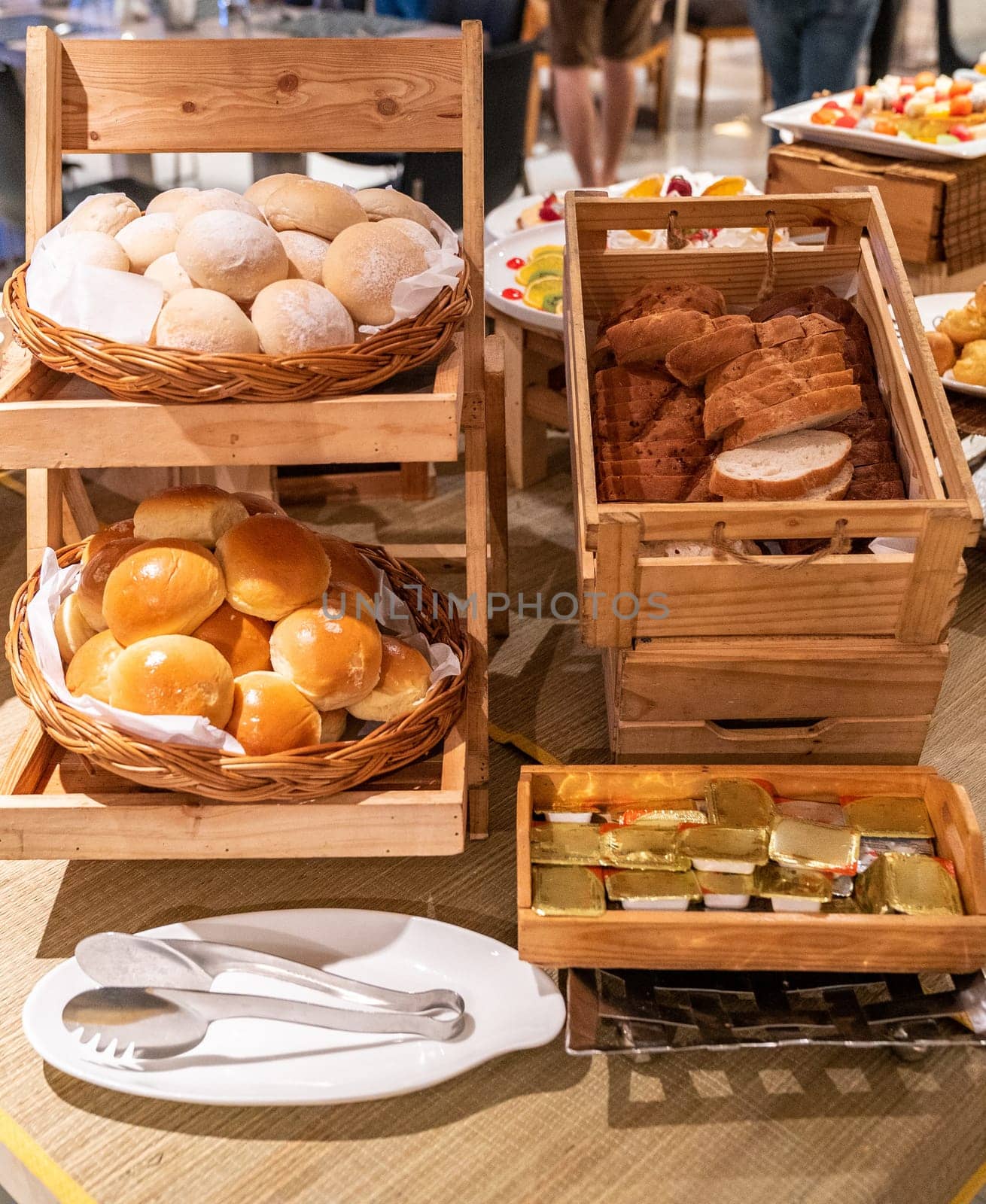 variety of bakery bread and rolls station in buffet line