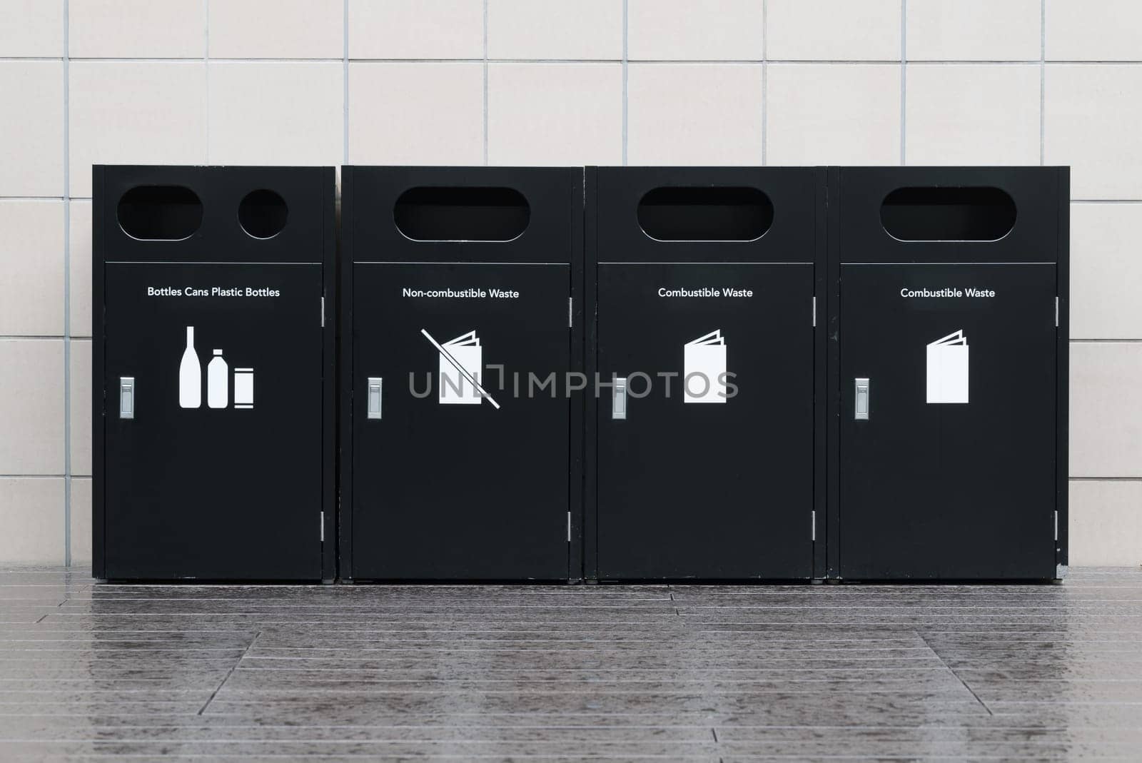 Recycle bins for rubbish, recycling and garden waste, over white wall background