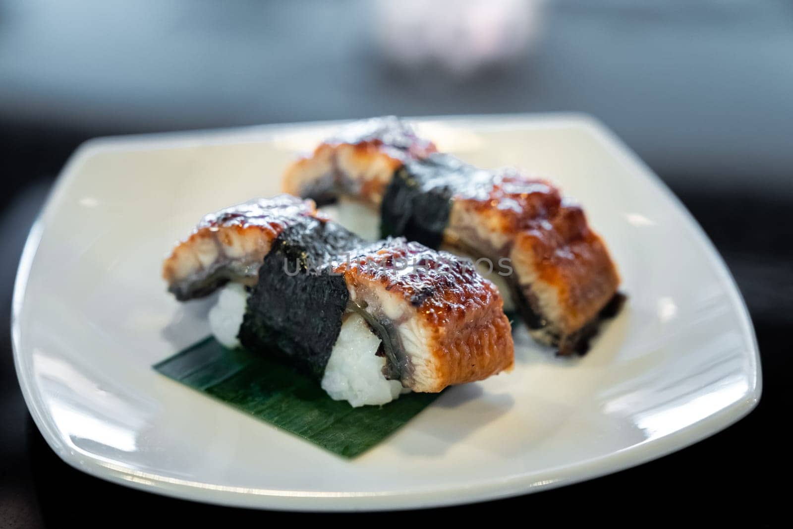 Unagi eel sushi, japanese food traditional cuisine, on white plate